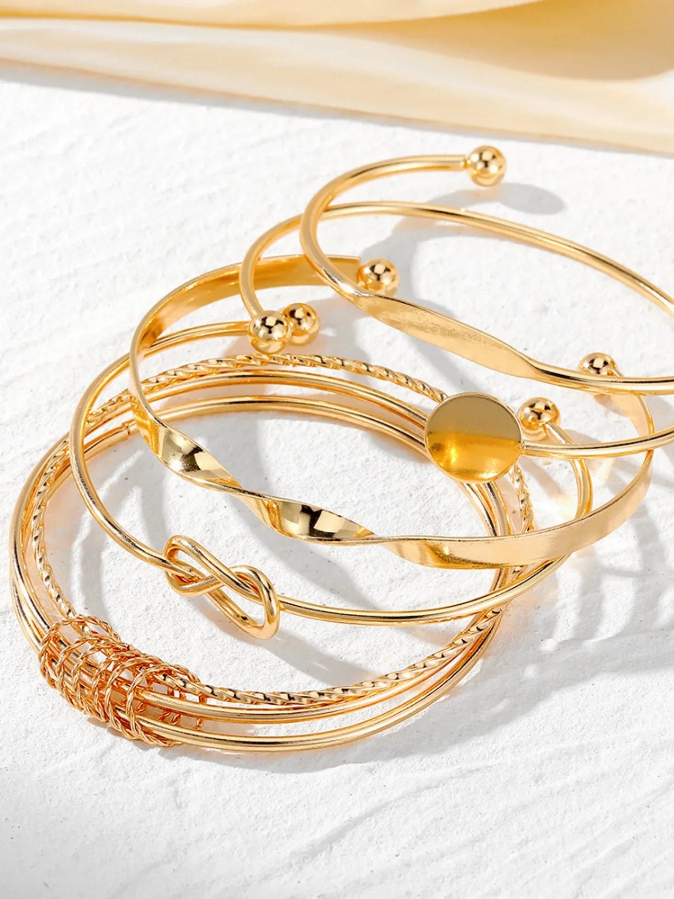 Elegant Twist Bangle Collection