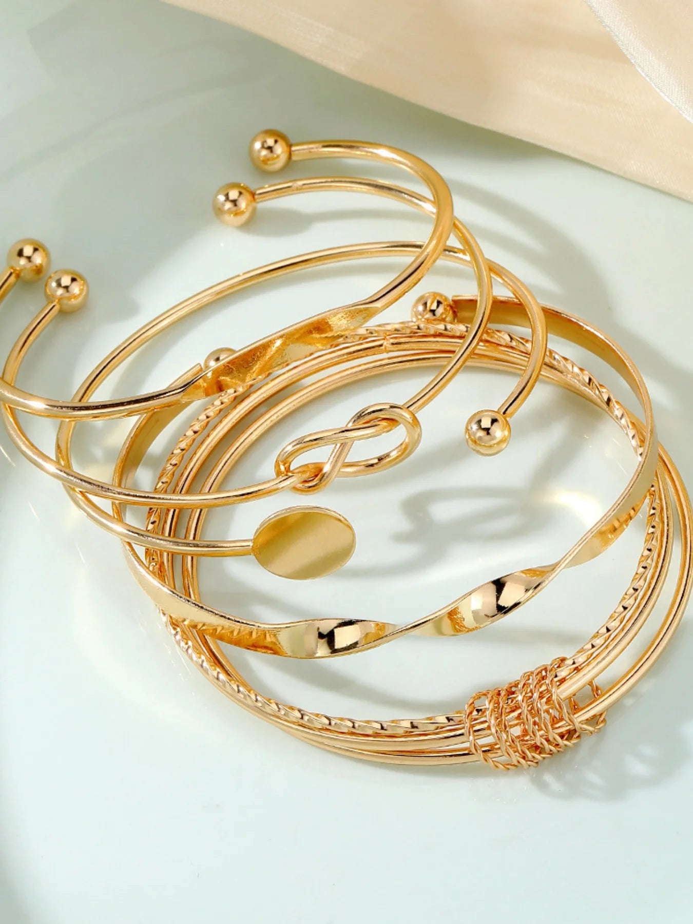 Elegant Twist Bangle Collection